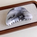 Detail view of the gray ink marble hair claw clip with a polished acetate texture finish - Semi-Circle (27267E)
