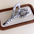 Macro detail of the gray ink pattern marble hair claw clip with golden metal spring - Tulip (27267J)
