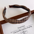 Close-up of brown plaid twisted headband with anti-slip teeth and fabric texture - Coffee Plaid Style (27293H)