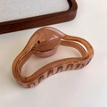 Detailed view of coffee brown wavy geometric hair claw clip with a resin finish - Transparent Coffee Half-Circle (27315T)