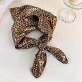 Detail of silk satin leopard print headscarf with knot design on white tabletop - Approx 60*60cm / Coffee Leopard