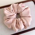 Macro shot of large light pink matte satin scrunchie displayed on a minimalist tray - Rice Pink