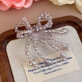 Détail d'un nœud en perles lavande avec de jolies pampilles pour accessoires de chaussures - Gland à Nœud Lavande (27337-22)