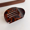 Close-up of the smooth leopard print tortoiseshell hair claw clip with glossy finish - Dark Leopard Oval Clip (27373L)