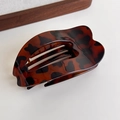 Close-up of leopard pattern hair claw with smooth heart-shaped design on white surface - Dark Leopard Large Heart Clip (27373M)