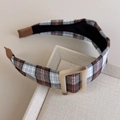 Detail of vintage brown plaid headband with a square buckle on a beige tray - Tartan Plaid Style (27367D)