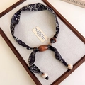 Detail of vintage leopard print fabric necklace with wooden beads and marble accents - Navy Paisley Style (27438B)