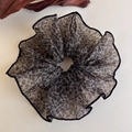 Close-up of leopard print hair scrunchie made of light semi-transparent chiffon fabric - Brown Black Leopard Organza Ruffle (27333B)