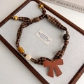 Detail of vintage brown plaid fabric necklace with leopard beads and leather bow charm - Coffee Plaid Bow (27445A)