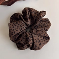 Macro shot of large leopard print scrunchie with soft pleated silk texture on beige base - Tan Leopard Chiffon Korean Style (27375B)