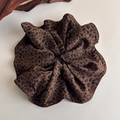 Detail of leopard print scrunchie with soft fabric texture and elastic design - Brown Black Leopard Large Style (27375D)