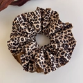 Close-up of leopard print hair scrunchie made of textured woven fabric for ponytails - Brown Black Leopard Woven Style (27382A)