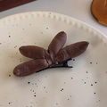 Close-up of padded brown satin bow hair clip with duckbill metal fastener - Coffee