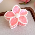 Detail of pink and white marble texture flower hair claw clip on a rustic wooden tray - Pink Multicolor