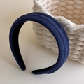 Detailed view of dark blue suede wide headband texture and thick sponge padding - Blue