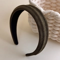Close-up of olive green suede padded headband with non-slip black inner lining - Green