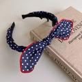 Detailed view of navy polka dot headband with red trim and non-slip inner teeth - Polka Dot Style (27465B) / Navy Blue Polka Dot