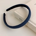 Detail of dark blue knitted headband texture with vertical diagonal striped pattern - Blue