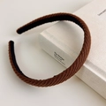 Detailed close-up showing the brown knitted texture and diagonal stripe pattern of the headband - Brown