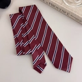 Detail of burgundy striped necktie with silky texture and classic diagonal pattern - Black Striped Style (27316L)