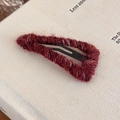 Close-up of wine red yarn-wrapped knit hair clip with yellow and white fiber details - Red