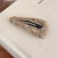 Close-up of khaki yarn-wrapped triangle snap clip with colorful speckles for autumn - Apricot