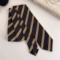 Close-up of stylish black and yellow striped tie folded neatly on a minimalist background - Black with Yellow Striped Style (27316K)