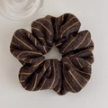 Detailed view of autumn winter striped knitted scrunchie with warm wool texture - Hair Tie / Brown