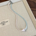 Detailed macro view of beaded mushroom necklace with pink and blue beads in jewelry tray - Pink Blue Splicing (26907A)