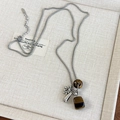 Close-up of bohemian silver box chain necklace with tiger eye stone and drop pendants - Tiger Eye Stone (26928E)
