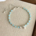 Detailed shot of blue beaded bracelet with silver dolphin charm and adjustable lobster clasp - Dolphin Charm (27030C)