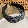 Detailed close-up of a wide black straw braided headband with an intricate mesh texture - Grey Black