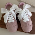 Close-up of pink suede sneakers with wide white silk ribbon bow laces on a tray - 120cm / White Style (27051A)