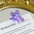 Close-up of handmade purple crystal flower shoe charms with elegant beaded petals - Purple and Light Blue 3D Woven Style (27059-14)