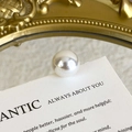 Close-up of high-quality large round white pearl accessory with smooth glossy finish - Round White Pearl Style (27059-34)