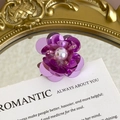 Detailed macro shot of purple sequin flower shoe charm with a pink faux pearl center - Purple Sequin with Faux Pearl Style (27059-38)