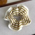 Detailed close-up of yellow and white striped fabric scrunchie with soft cotton texture - Yellow White Striped Piping