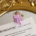 Detailed shot of handmade purple beaded flower charm with green leaf accents on card - Pink-Purple and Olive Green Faceted Bead Style (27059-59)