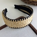 Detail of bohemian straw headband featuring woven texture and black contrast stitching edge - 26747