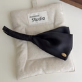 Elegant black satin wing-shaped banana hair clip featuring a refined golden metal plate - Solid Black