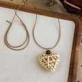 Detailed view of hand-woven heart-shaped rattan pendant with vintage wooden bead and cord - Heart Rattan Woven Style (27039E)