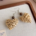 Detail of handmade woven heart earrings with dark wood beads on linen tray - Woven Heart (27218E)