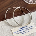 Detailed macro view of silver hoop earrings showing dual texture matte and polished finish - Silver 5cm Diameter