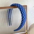 Detail of blue plaid headband showing the handmade label and non-slip inner lining - Mixed Blue Plaid