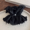 Primer plano de un coletero vintage de malla negra con lazo de diamantes en una bandeja - Estilo De Cintura Pequeña (26578A)