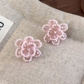 Macro detail of handmade pink beaded flower charms with transparent crystal accents - Pink Pearl Crystal Flower