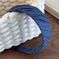 Detailed macro view of deep blue denim headband with elegant pleated texture and fabric - Dark Blue Solid