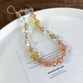 Detail of handmade beaded phone strap with colorful glass flowers and butterfly beads - Colorful Iridescent Orange Yellow