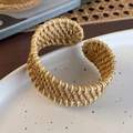 Macro detail of hand-woven rattan bangle featuring a dense bohemian cross-weave texture - Light Woven Open Style (26684A)