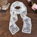 Close-up of white lace floral ribbon with Japan embroidery on a vintage wood desk - Coconut Tree Wide Edge (26737G)